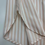 Comfortable women's striped pajama pants in beige and white, perfect for loungewear and sleepwear, made from soft, breathable fabric.