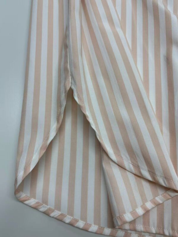 Comfortable women's striped pajama pants in beige and white, perfect for loungewear and sleepwear, made from soft, breathable fabric.