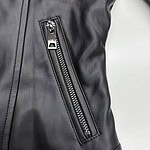 Close-up of a black leather jacket featuring a vertical zipper pocket, showcasing high-quality material and stylish design for fashion enthusiasts.
