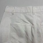 Close-up of white denim pants showing back pocket and waistband details, perfect for casual or stylish everyday wear.