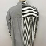 Men's long-sleeve shirt with a unique black and white striped pattern, featuring a mix of vertical and horizontal lines, displayed on a mannequin.