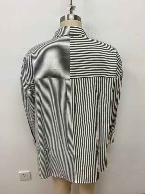 Men's long-sleeve shirt with a unique black and white striped pattern, featuring a mix of vertical and horizontal lines, displayed on a mannequin.