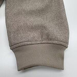 Close-up of a beige sweatshirt cuff showing soft fabric and ribbed knit design, ideal for casual fashion and comfortable wear.