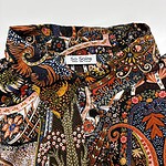 Colorful bohemian patterned shirt with intricate floral and paisley designs, perfect for casual or festival wear.