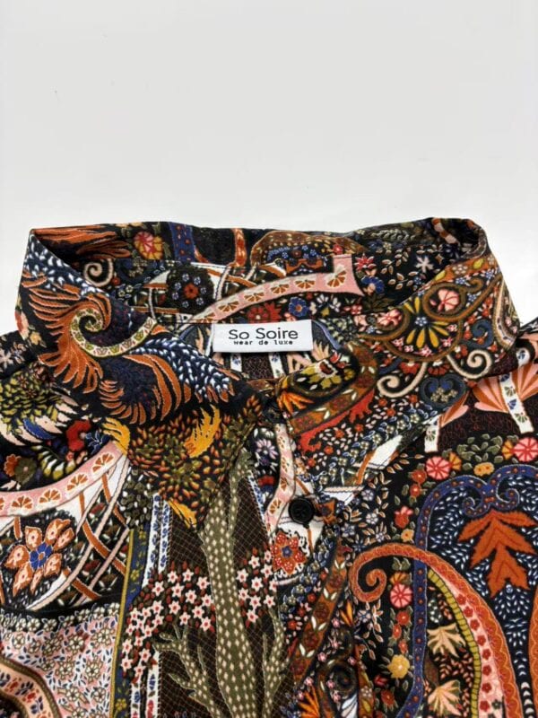 Colorful bohemian patterned shirt with intricate floral and paisley designs, perfect for casual or festival wear.