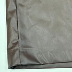 Close-up of taupe fabric with smooth texture, ideal for fashion and clothing projects.