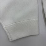 Close-up of white hoodie fabric showing texture and stitching details, ideal for fashion and apparel SEO.