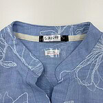 Blue linen shirt with white leaf pattern, casual and elegant, perfect for summer wear, from NBFish Fashion.