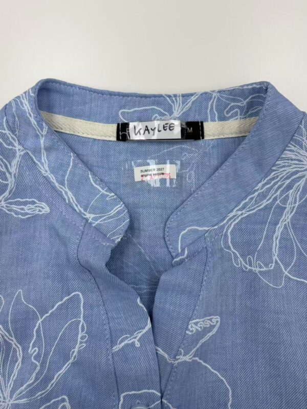 Blue linen shirt with white leaf pattern, casual and elegant, perfect for summer wear, from NBFish Fashion.