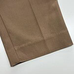 Close-up of a smooth, brown fabric with a clean hem, suitable for fashion and clothing projects.