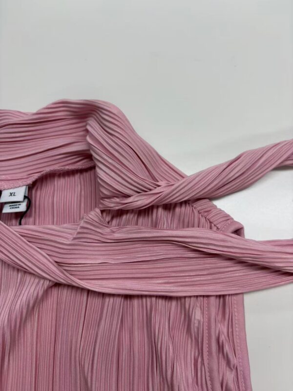 Elegant pink pleated dress with a matching belt, perfect for stylish occasions and fashion-forward outfits.