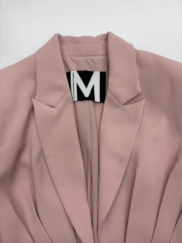 Stylish pink blazer with tailored fit, perfect for office or casual wear, featuring a classic lapel collar and sleek design.