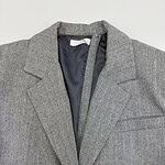 Elegant men's grey herringbone suit jacket with notch lapel, ideal for formal occasions and professional settings.