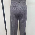 Elegant women's plaid dress pants with a high waist and tailored fit, suitable for professional and formal occasions.