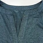 Close-up of a blue sequin dress with a V-neckline, detailed with small shimmering sequins, perfect for evening wear or special occasions.