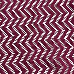 Close-up of burgundy fabric with white zigzag pattern, showcasing intricate textile design suitable for fashion and home decor.
