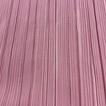 Close-up of pink fabric with vertical striped pattern, ideal for fashion and clothing projects.