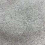 Close-up of soft gray fabric texture suitable for fashion and textile design projects.