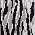 Close-up of zebra print fabric featuring black, white, and gray stripes, ideal for fashion and interior design projects.