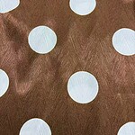 Close-up of brown fabric with white polka dots, suitable for fashion and clothing design projects.