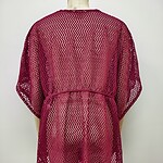 Red lace cover-up with intricate zigzag pattern, lightweight and stylish, perfect for beachwear or summer outings.