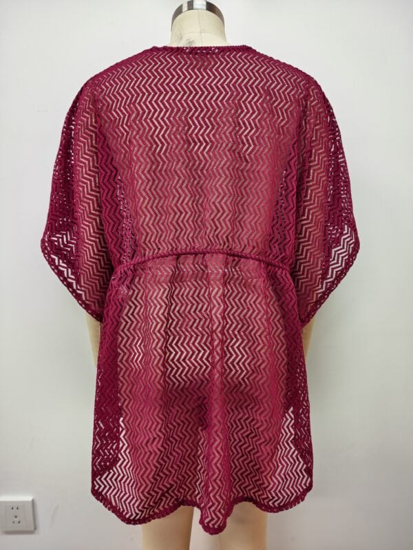 Red lace cover-up with intricate zigzag pattern, lightweight and stylish, perfect for beachwear or summer outings.
