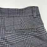 Close-up of stylish gray checkered dress pants with a tailored fit, suitable for formal occasions and office wear.