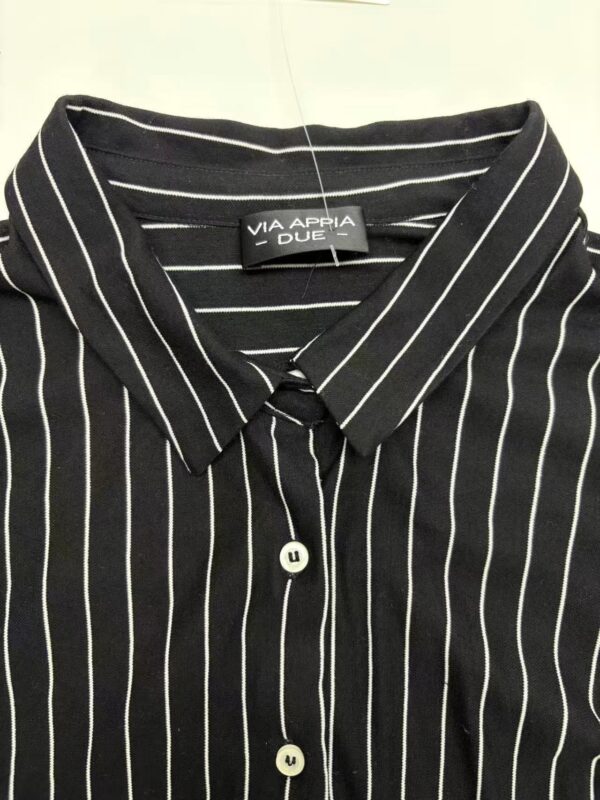 Men's black shirt with white vertical pinstripes, classic collar, and button-down front, suitable for formal or business casual wear.