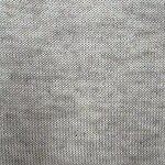 Detailed close-up of light gray knit fabric showing fine stitches and texture, ideal for fashion and textile design.