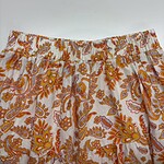 Colorful bohemian style skirt with orange, yellow, and pink paisley and floral patterns, elastic waistband, perfect for casual summer wear.