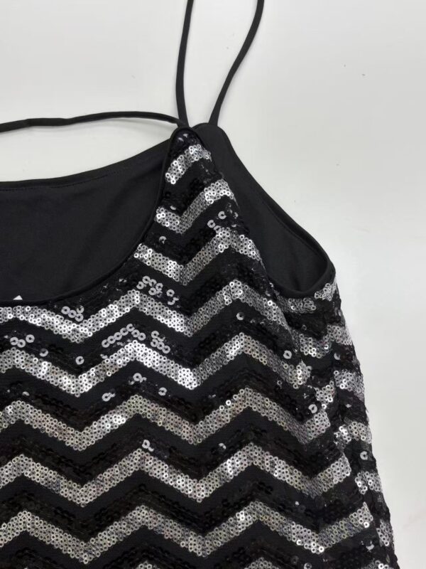 Elegant black dress with silver sequins in a zigzag pattern, featuring thin spaghetti straps, perfect for evening wear or special occasions.