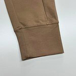 Close-up of beige sweatpants cuff showing soft fabric and stitching, ideal for casual and athleisure wear.