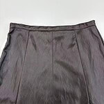 High-quality black leather skirt with detailed stitching, perfect for stylish and professional outfits.