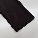 Close-up of a black long sleeve shirt sleeve, showcasing the fabric and stitching details, ideal for men's fashion and casual wear.