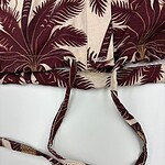 Close-up of a tropical leaf print drawstring bag with adjustable straps, perfect for casual summer outings and beach trips.