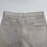 Close-up of beige casual pants showing back pockets and waistband, suitable for everyday wear and fashion styling.