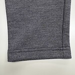 Close-up of black and white textured fabric, suitable for fashion or upholstery projects.