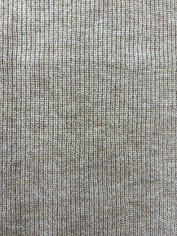 Close-up of textured fabric with fine vertical lines in beige and light brown tones, showcasing detailed weave pattern.