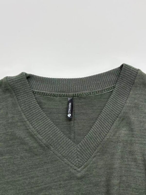 Close-up of men's olive green V-neck sweater made from soft fabric, featuring ribbed neckline and seamless design, ideal for casual and professional wear.