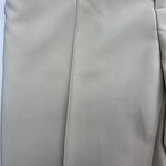 Close-up of smooth, light gray fabric with subtle texture and stitching details, ideal for fashion or upholstery applications.