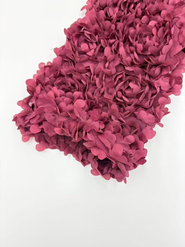 Close-up of a vibrant pink hydrangea flower arrangement with detailed petals on a white background.