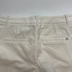 Close-up of cream-colored casual pants with back pockets, suitable for everyday wear and fashion.