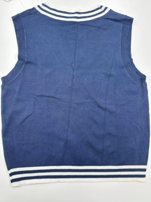 Blue sleeveless sweater vest with white striped collar and hem, suitable for children, made of soft knit fabric, perfect for casual or school wear.