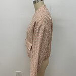 Stylish pink tweed jacket with intricate detailing, perfect for fashionable women. Showcased on a mannequin against a plain white background.