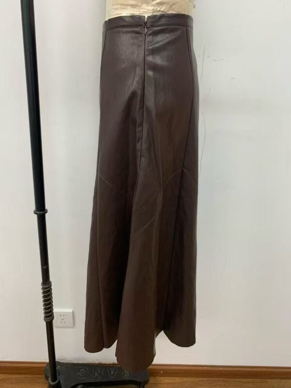 Stylish brown leather wide-leg pants displayed on a mannequin, perfect for fashion-forward outfits and versatile styling.