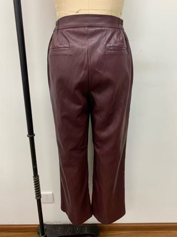Stylish burgundy leather wide-leg pants with back pockets, perfect for fashion-forward women seeking a chic and comfortable look.