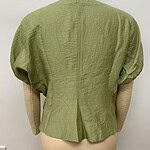Front view of a stylish green textured blouse with puffed sleeves, displayed on a mannequin, perfect for casual or formal wear.
