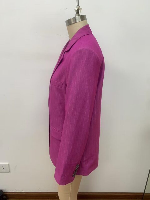Stylish pink blazer for women, tailored fit with lapel collar and button details, perfect for office or casual wear.