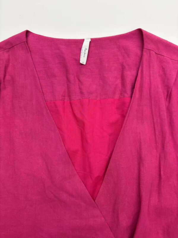 Bright pink linen blouse with V-neck design, perfect for casual or formal wear, displayed on a white background.