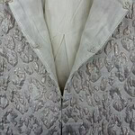 Close-up of a luxurious summer jacket with intricate embroidery and a soft, light fabric, perfect for stylish summer wear.